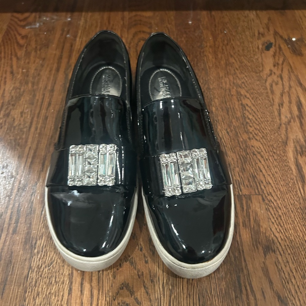 MICHAEL Michael Kors Black Flats with Silver Accents